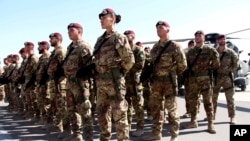 FILE - Italian soldiers with the NATO-led International Security Assistance Force (ISAF) at Camp Arena, Herat Airport, west of Kabul, Afghanistan, Sept, 10, 2013. 