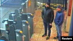 Alexander Petrov and Ruslan Boshirov, who were formally accused of attempting to murder former Russian intelligence officer Sergei Skripal and his daughter Yulia in Salisbury, are seen on CCTV at Salisbury Station, March 3, 2018, in an image handed out by