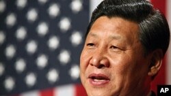 Chinese Vice President Xi Jinping speaks during a formal dinner at the Iowa Statehouse in Des Moines, Iowa during his visit to the United States, February 15, 2012.