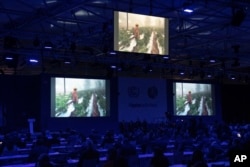 A video on climate change will be played during the opening session of the COP26 UN Climate Summit, 1 November 2021, in Glasgow, Scotland.