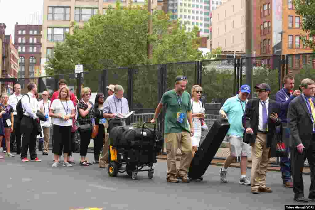 The security line for media, many lugging large pieces of equipment, to gain access to the Cleveland Convention Center was lengthy at times Monday, the day the Republican National Convention started, in Cleveland, July 18, 2016.
