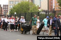 The security line for media, many lugging large pieces of equipment, to gain access to the Cleveland Convention Center was lengthy at times Monday, the day the Republican National Convention started, in Cleveland, July 18, 2016.