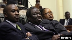 Zimbabwe Vice President Joice Mujuru (R), Prime Minister Morgan Tsvangirai (C) and member of the House of Assembly of Zimbabwe for Kuwadzana, Nelson Chamisa, attend the presentation of the Final Draft of the Constitution for debate in Parliament Building 