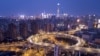 2018年2月14日，在农历新年前夕，夜色中灯光下的上海市天际线和南浦大桥。