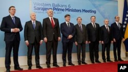 From left, Prime Ministers Aleksandar Vucic (Serbia), Dusko Markovic (Montenegro), Edi Rama (Albania), Denis Zvizdic (Bosnia), EU Commissioner for Enlargement Johannes Hahn, Emil Dimitriev (Macedonia), Isa Mustafa (Kosovo) and Italian Foreign Minister Angelino Alfano poses for photo during a summit of Western Balkan leaders in Sarajevo, Bosnia, March 16, 2017. 