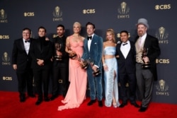 Actors Jeremy Swift, Phil Dunster, Brett Goldstein, Hannah Waddingham, Jason Sudeikis, Juno Temple, Nick Mohammed and Brendan Hunt, cast members of "Ted Lasso", pose for a picture together at the 73rd Primetime Emmy Awards in Los Angeles, U.S.