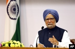 FILE - former Indian Prime Minster Manmohan Singh addresses a press conference.