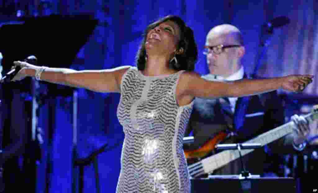 Singer Whitney Houston performs at the pre-Grammy gala & salute to industry icons with Clive Davis honoring David Geffen, Sunday, Feb. 13, 2011, in Beverly Hills, Calif. (AP Photo/Mark J. Terrill)