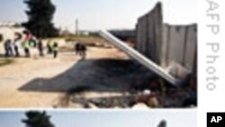 W. Bank Palestinians Tear Down Segment of Barrier Wall