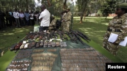 Kenya wildlife officials display firearms recovered from elephant poachers at their headquarters, Nairobi, June 22, 2012.