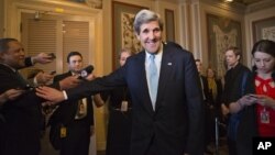 Sen. John Kerry, D-Mass., emerges after a unanimous vote by the Senate Foreign Relations Committee approving him to become America's next top diplomat, replacing Secretary of State Hillary Rodham Clinton, on Capitol Hill in Washington, January 29, 2013.