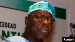 FILE - Former Nigerian President Olusegun Obasanjo speaks to journalists at a news conference in Dakar, Senegal, Feb. 25, 2012. 