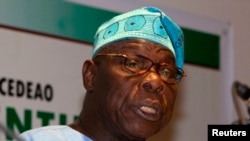 FILE - Former Nigerian President Olusegun Obasanjo speaks to journalists at a news conference in Dakar, Senegal, Feb. 25, 2012.