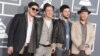 From left, Marcus Mumford, Ben Lovett, Country Winston and Ted Dwane, of musical group Mumford & Sons, arrive at the 55th annual Grammy Awards in Los Angeles, Feb. 10, 2013. 