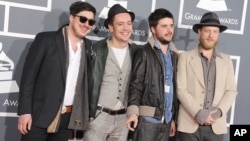From left, Marcus Mumford, Ben Lovett, Country Winston and Ted Dwane, of musical group Mumford & Sons, arrive at the 55th annual Grammy Awards in Los Angeles, Feb. 10, 2013. 