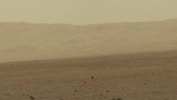 FILE - This color image taken August 8, 2012 from NASA's Curiosity rover, and released August 13, shows part of the wall of Gale Crater, the location on Mars where the rover landed on August 5, 2012.