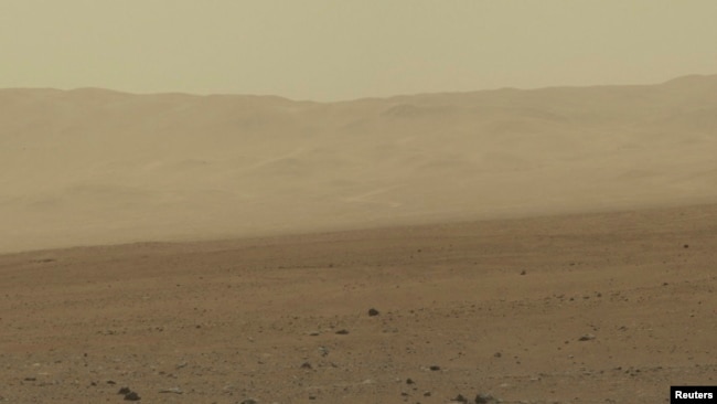 FILE - This color image taken August 8, 2012 from NASA's Curiosity rover, and released August 13, shows part of the wall of Gale Crater, the location on Mars where the rover landed on August 5, 2012.