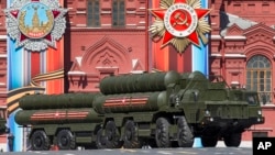 FILE - Russian S-400 air defense missile systems are on display during a rehearsal for the Victory Day military parade in Red Square in Moscow, Russia, May 7, 2017. 