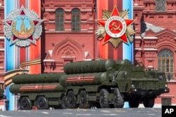 FILE - Russian S-400 air defense missile systems are on display during a rehearsal for the Victory Day military parade in Red Square in Moscow, Russia, May 7, 2017.