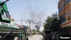 Smoke rises from an area where explosions and gunshots were heard, in Jalalabad city, Afghanistan, July 28, 2018. 