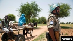 FILE - A UNAMID peacekeeper is seen on patrol in Sudan.