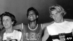 Dorothy Hyman of Great Britain, Wilma Rudolph of the U.S. and J. Heine of West Germany pose after the 200 meter race at the XVI Summer Olympic Games in Rome