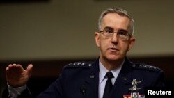 FILE - U.S. Air Force General John Hyten, then-commander of U.S. Strategic Command, testifies in a Senate Armed Services Committee hearing on Capitol Hill in Washington, April 4, 2017.