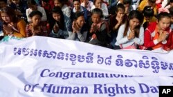 People gather at Freedom Park during a Human Rights Day celebration in Phnom Penh, Cambodia, Dec. 10, 2016.