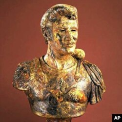 This ceramic bust by Robert Arneson features a rock on Elvis' shoulder, a reference to the entertainer's status as the ''King of Rock'.