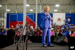 FILE - Democratic presidential candidate Hillary Clinton speaks at the Union of Carpenters and Millwrights Training Center during a campaign stop in Louisville, Kentucky, May 15, 2016.