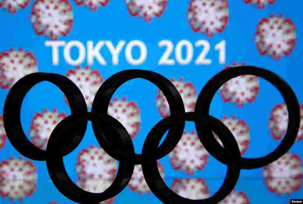 A 3D printed Olympics logo is seen in front of displayed &quot;Tokyo 2021&quot; words in this illustration in Japan.