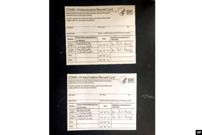 Undated image provided by the United States District Court for the Northern District of California shows two fake CDC COVID-19 Vaccination Record Cards that are part of a criminal complaint.