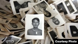 A pile of mugshots provided to the Documentation Center of Cambodia by an anonymous collector. (Credit: DC-Cam)