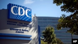 FILE - In this Oct. 8, 2013, file photo, a sign marks the entrance to the federal Centers for Disease Control and Prevention, in Atlanta, Georgia.