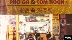 Many Vietnamese shops carry signs in Chinese, a lingering sign of the shared history, though Vietnam and China have taken different turns in the modern economy. (H. Nguyen/VOA)