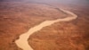 FILE - A dried up river filled with sand winds its way across the desert near Gos Beida in eastern Chad June 5, 2008. Africa's Sahel region suffers from desertification as fertile land gives way to sandy expanses creeping ever southward.