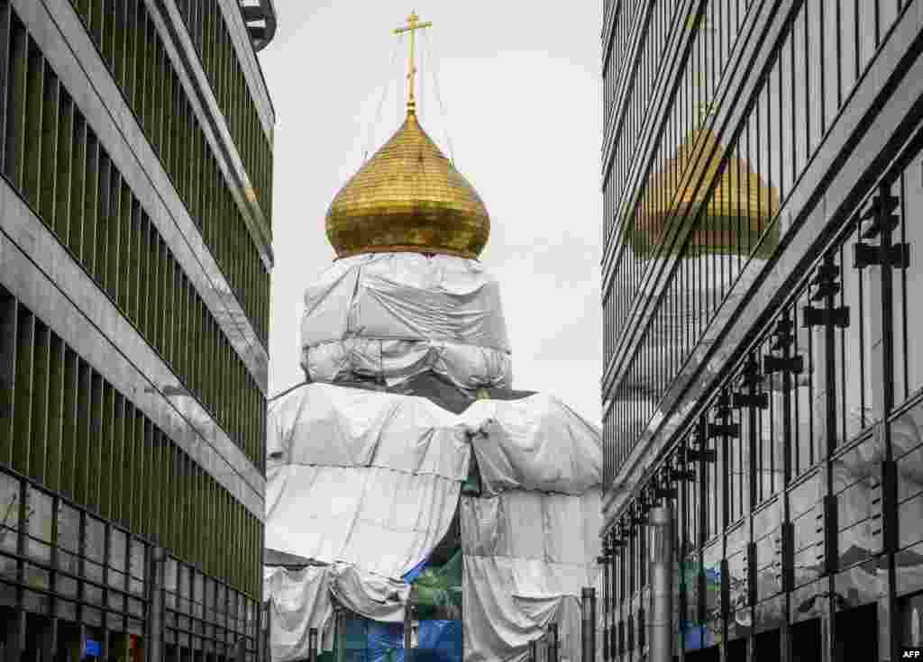 The church of Saint Nicholas on Tverskaya Zastava is under plastic sheets during its restoration in Moscow.