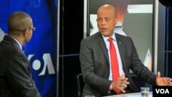 Haitian President Michel Martelly (r) during an interview at VOA headquarters in Washington, Feb 7, 2014.