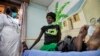 Newly-diagnosed HIV-positive woman receives treatment at the Mildmay Uganda clinic, Kampala, Feb. 27, 2014.