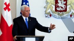 U.S. Vice President Mike Pence gestures while speaking at a news conference in Tbilisi, Georgia, Tuesday, Aug. 1, 2017. 
