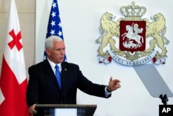 U.S. Vice President Mike Pence gestures while speaking at a news conference in Tbilisi, Georgia, Tuesday, Aug. 1, 2017.