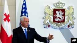 U.S. Vice President Mike Pence gestures while speaking at a news conference in Tbilisi, Georgia, Tuesday, Aug. 1, 2017. 