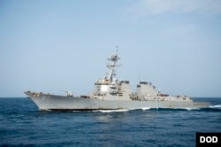 The guided-missile destroyer USS Mason is replenished at sea. The ship responded to an incoming missile threat off Yemen’s coast Oct. 12, 2016.