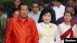 Cambodia's Prime Minister Hun Sen and his wife Bun Rany hold a ceremony at the Angkor Wat temple to pray for peace and stability in Cambodia, in Siem Reap province, Cambodia, Dec. 3, 2017. 