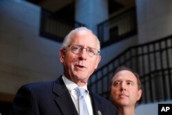 Rep. Mike Conaway, R-Texas, left, a member of the House Intelligence Committee, and Rep. Adam Schiff, D-Calif., ranking member of the House Intelligence Committee speak after closed meeting. June 6, 2017, in Washington.