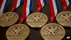FILE - National Medals of Technology and Innovation are seen in the East Room of the White House in Washington.