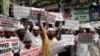 FILE - Indian Muslims shout slogans during a protest against the Chinese government, in Mumbai, India, Sept. 14, 2018. Protesters demanded that China stop detaining ethnic Uighurs in detention and political indoctrination centers in Xinjiang region.