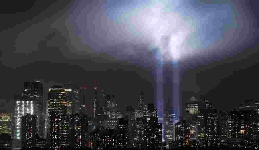 A test of the Tribute in Light rises above lower Manhattan, New York. The memorial will light the sky on the evening of Sept. 11, 2011. AP Photo/Mark Lennihan)