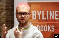 Chris Wylie of Canada, who once worked for the U.K.-based political consulting firm Cambridge Analytica, gives a talk at the Frontline Club in London, March 20, 2018.