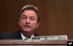 FILE - Sen. Dean Heller, a Nevada Republican, asks a question during a committee hearing on Capitol Hill in Washington, Jan. 30, 2018.